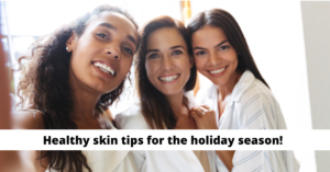 Three smiling women of diverse ethnicities posing closely together for a selfie, representing a joyful and friendly atmosphere. text overlay: "healthy skin tips for the holiday season!.