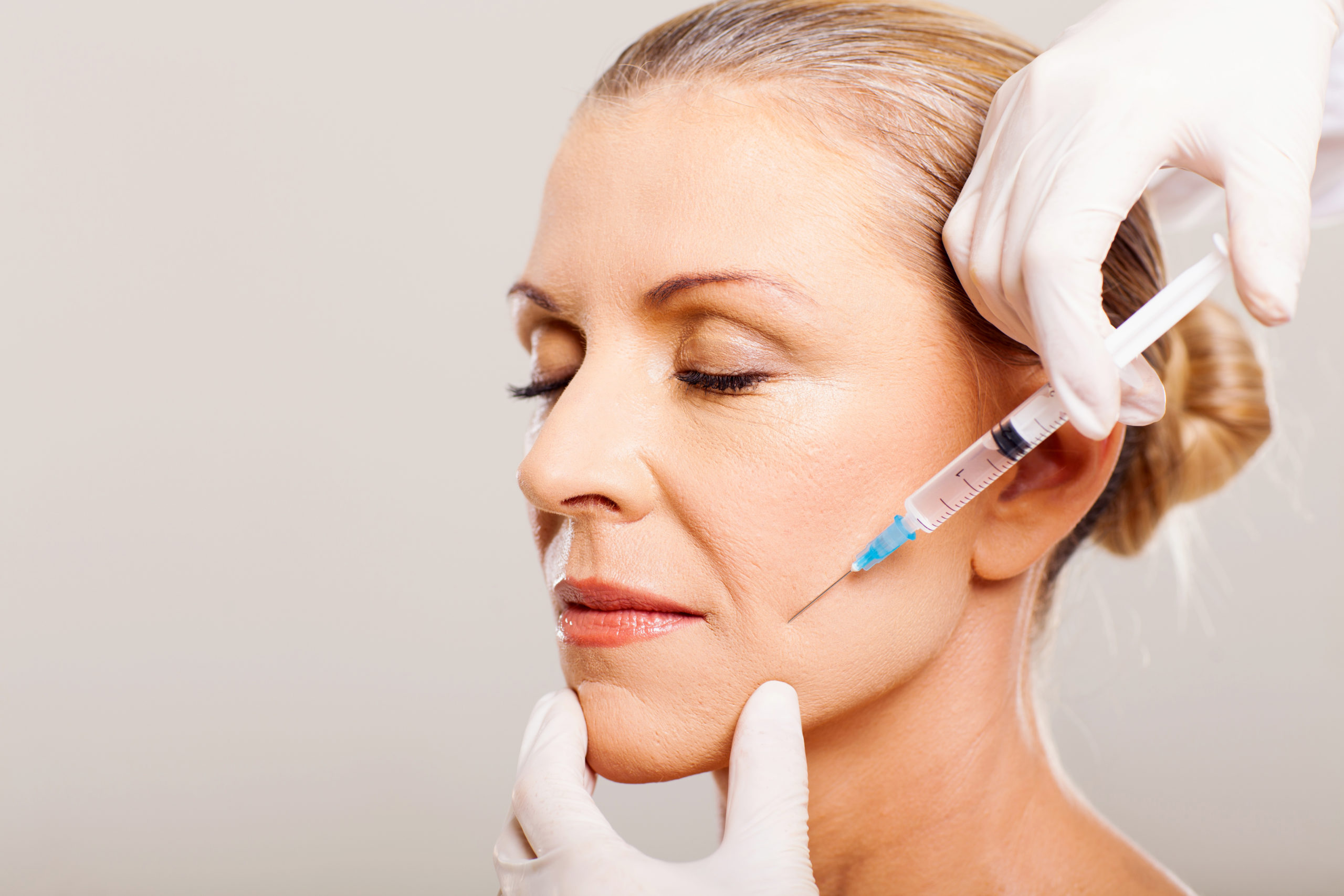 Older woman getting Botox. For blog from Advanced Skin + Body Aesthetics Lincoln Spa