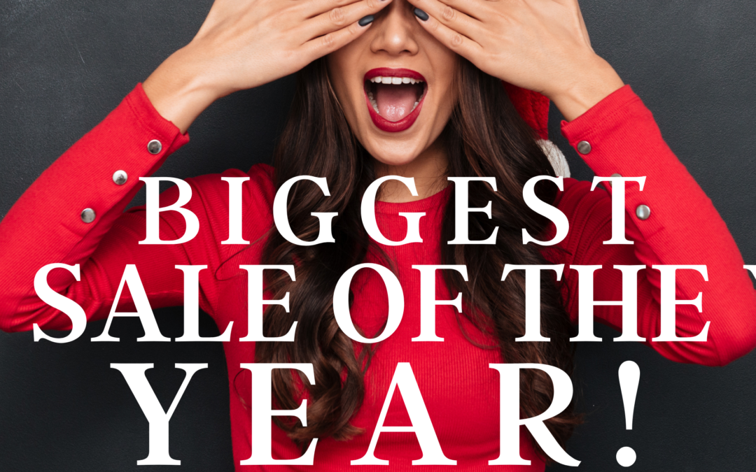 A woman in a santa hat covers her eyes with her hands, laughing, with text overlay reading "biggest sale of the year! everything on sale learn more at AdvancedSkinBody Clinic!" on a